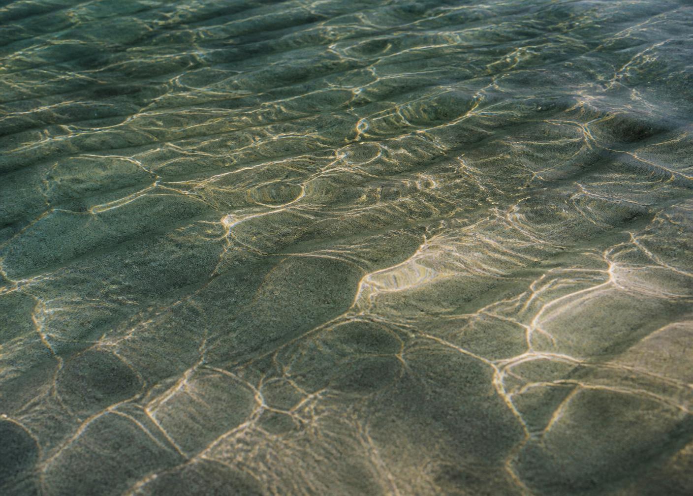 Morning light reflected across calm water